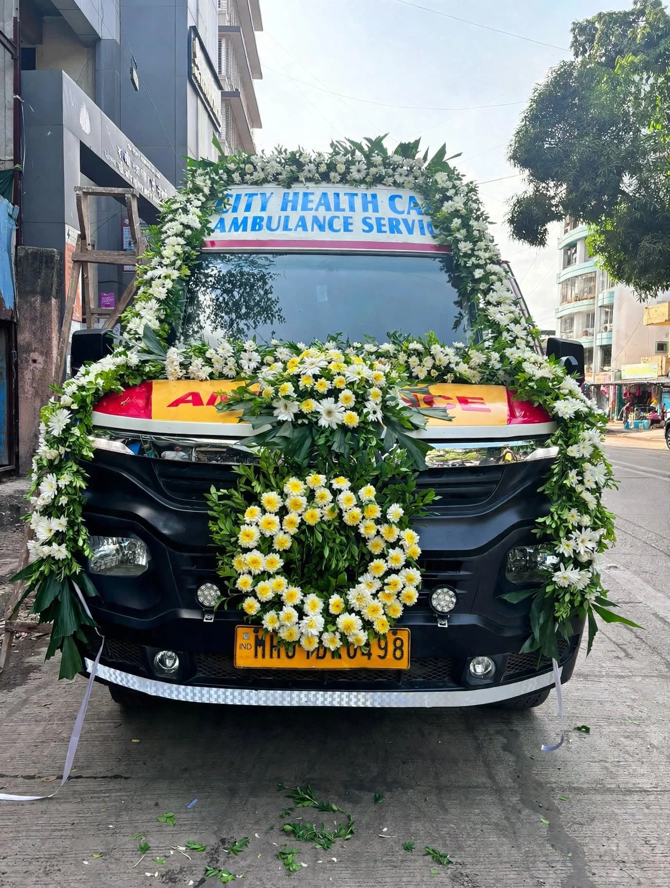 AIVA mortuary ambulance decorated with fresh flowers for a final journey