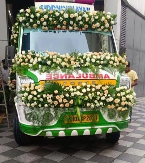 Flower-decorated ambulance arranged for last rites in Mumbai