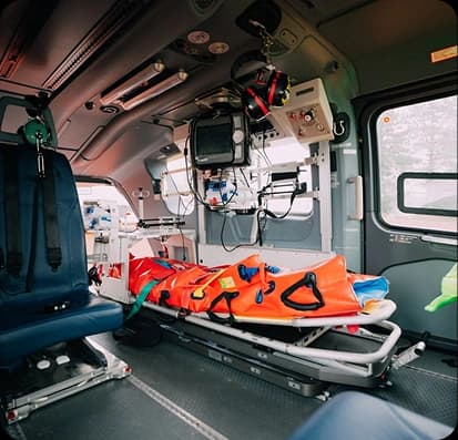 Patient being transported in ambulance